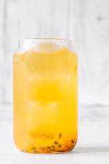 Waltzing Matilda cocktail with passion fruit, gin, and ginger ale in jar glass