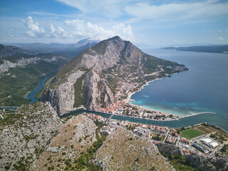 Panoramic view of the Omis town, Cetina canyon and river and surrounding mountains, Croatia