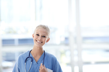 Portrait, nurse and happy woman in hospital with stethoscope for healthcare, wellness and...