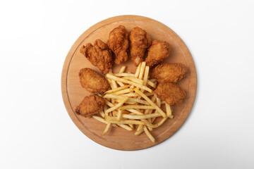 fried chicken wings and chips on a wooden board