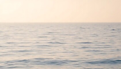 Obraz premium Calm Ocean Waves Under a Pale Sky