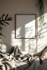 A white-framed picture with a blank space is hung on a light beige wall, accompanied by a plant and a shadow cast by the sun. A4 frame mockup