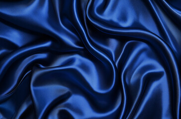A top view of a navy blue smooth fabric background, captured in high-resolution photography. The intricate details of the fabric's texture are clearly visible, creating a refined, elegant, and polishe
