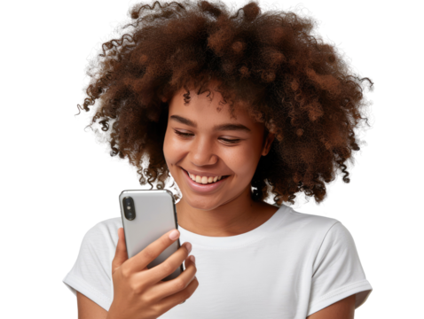 A portrait of a young African American black woman with curly hair looking at her mobile phone and smiling, isolated in a transparent background. Cut out or PNG.
