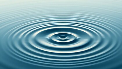 Abstract concentric ripples on tranquil blue water surface