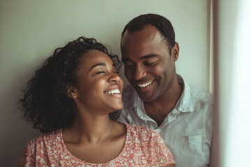 Obraz premium Couple is smiling and laughing.