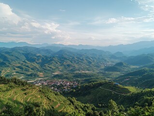 Fototapeta premium Panoramic View of a Valley with Terraced Fields and Distant Mountain Ranges