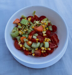 Fresh Summer Salad with Cherry Tomatoes, Cucumber, Corn, and Carrots