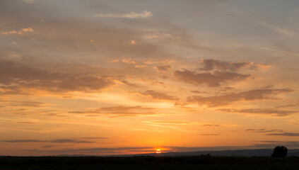 Sunset over the Balkans. The stillness and the dusk. Cirrus clouds in a crimson sky.