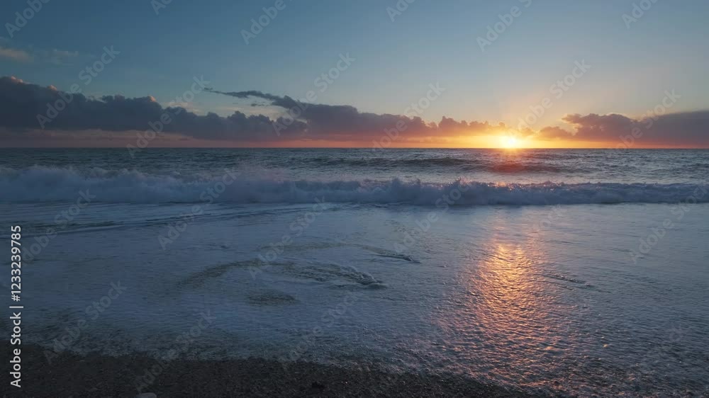 Wall mural stunning sunset over sea with vibrant colors reflecting on the water at the beach, 4k