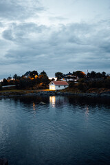 The Serene Coastal Evening with a Charming House Reflection Creates a Perfect Atmosphere