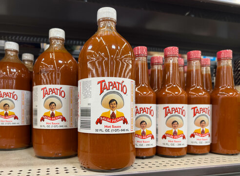 Bottles of Tapatio Brand hot sauce for sale at a California supermarket shelf