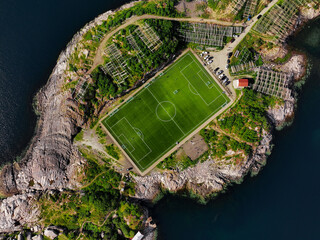 An Aerial View of a Beautiful and Scenic Football Field That is Completely Surrounded by Water