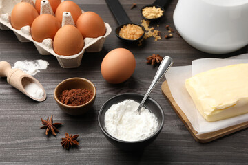 Baking powder and other products on grey wooden table