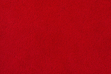 Suede red macro photo. Suede leather texture as a background.