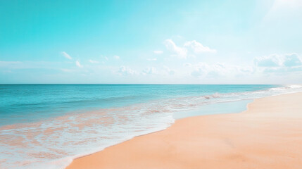 Fototapeta premium Tropical Beach Serenity: Soft, turquoise waves gently caress a pristine, sandy beach under a vibrant, blue sky. The tranquil scene evokes feelings of peace and escape.