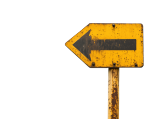A faded yellow road sign with a black upward arrow indicates that the route continues straight ahead, guiding travelers along their journey.