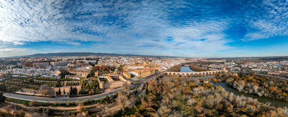 Aerial view of Cordoba Spain, Roman bridge over Guadalquivir river, Calahorra tower, Alcazar, Mosque Cathedral, medieval town center