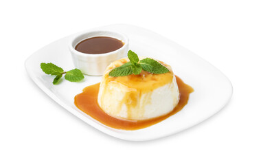 Tasty pudding with caramel sauce and mint isolated on white