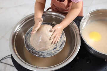 Hobby and craft. Girl making pottery indoors, closeup