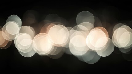 Abstract bokeh lights creating a soft, dreamy background with blurred circles of light