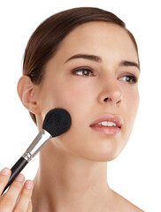 Woman, blush tool and apply makeup in studio, skincare and planning for facial transformation. Female person, cosmetic brush and thinking on dermatology treatment, foundation and white background