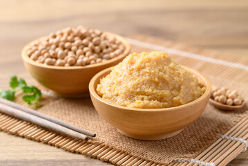 Miso paste in wooden bowl, Japanese seasoning made from fermenting soybeans with salt, Traditional food ingredient in Japanese cuisine