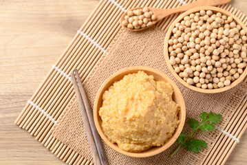 Miso paste in wooden bowl, Japanese seasoning made from fermenting soybeans with salt, Traditional food ingredient in Japanese cuisine