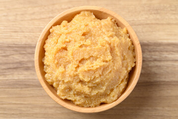 Miso paste in wooden bowl, Japanese seasoning made from fermenting soybeans with salt, Traditional food ingredient in Japanese cuisine