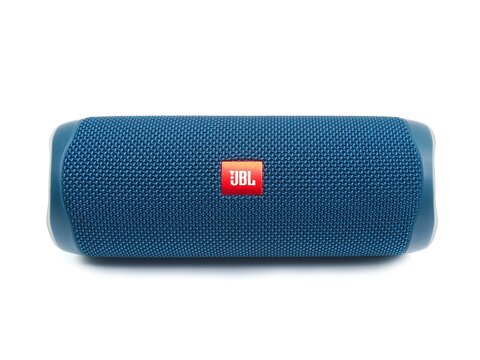 Loei, Thailand - September 12, 2023: Blue JBL Flip 5 portable Bluetooth speaker isolated on white background.