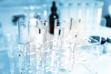 Clear bottles and dishes are used in scientific and medical experiments.