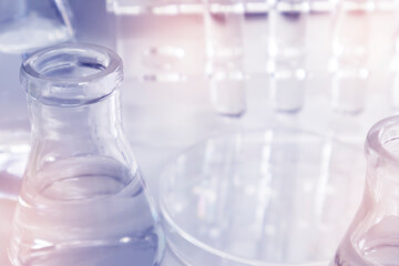 Clear bottles and dishes are used in scientific and medical experiments.