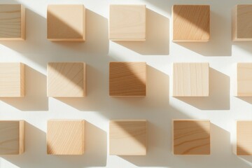 Obraz premium Wooden Blocks Arranged In A Grid Pattern With Light Shadows