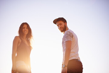 Portrait, sky and couple with vacation, travel and bonding together with happiness, smile and...