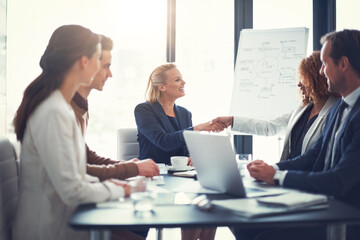 Office, meeting and business people with handshake for celebrate, sales partnership and b2b agreement. Flare, employee and investor with shaking hands for company growth, investment deal and laptop