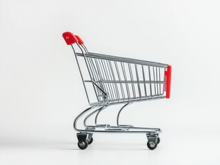 Shopping cart with a red handle in a retail environment filled with various products and groceries