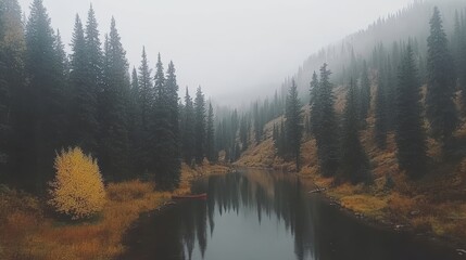 Misty Mountain Lake with Autumn Colors and Canoe
