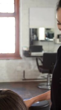 Woman getting her hair trimmed