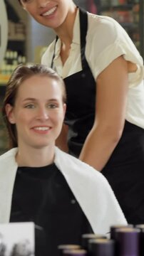 Hairdressers trimming their client hair