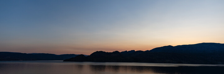 panorama beautiful sunrise scene over a tranquil Okanagan lake British Columbia Canada