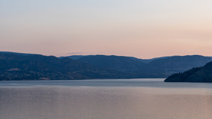 panorama beautiful sunrise scene over a tranquil Okanagan lake British Columbia Canada