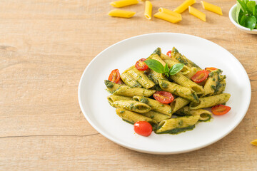 penne pasta with pesto sauce and tomatoes