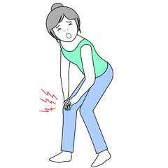 膝の痛みで手で押さえる女性