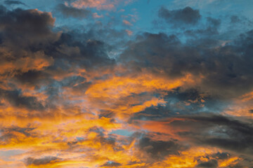 Colorful sunset sky with clouds and vibrant hues creating a peaceful natural landscape