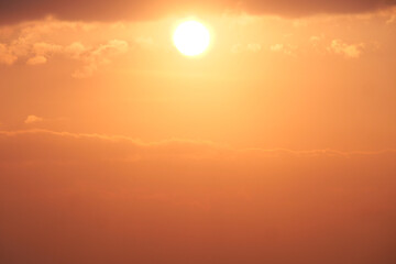 Golden Hour Sunset: A breathtaking sunset paints the sky in vibrant hues of orange and gold, as the sun descends below the horizon, casting a warm, ethereal glow.  