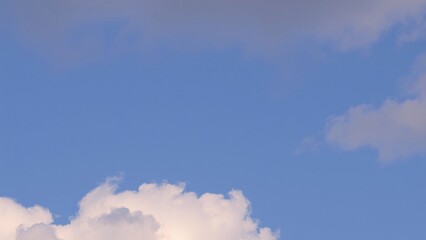 Serene Blue Sky with Puffy Cumulus Clouds