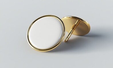 Pair of elegant gold cufflinks with white circular fronts, isolated on white background.