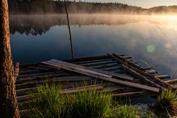 sunrise, sunset landscape by the swamp lake, morning fog, golden hour, reflections in the water, traditional swamp lake vegetation