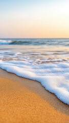 tranquil beach scene with soft waves gently lapping at golden sand, creating serene atmosphere during sunset. colors blend beautifully, evoking sense of peace and relaxation