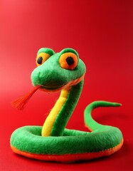 Fototapeta premium snake cartoonish, Felted, felt material isolated on red background